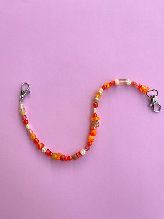 ORANGE FLORAL CHAIN BAG CHARM